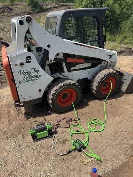 Rocky Top Painting & Construction branded skidsteer — Durango, CO