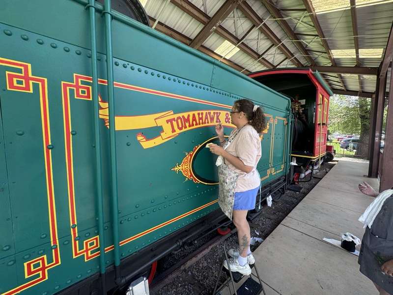 Painter detailing Tomahawk & Western car — Rocky Top Painting